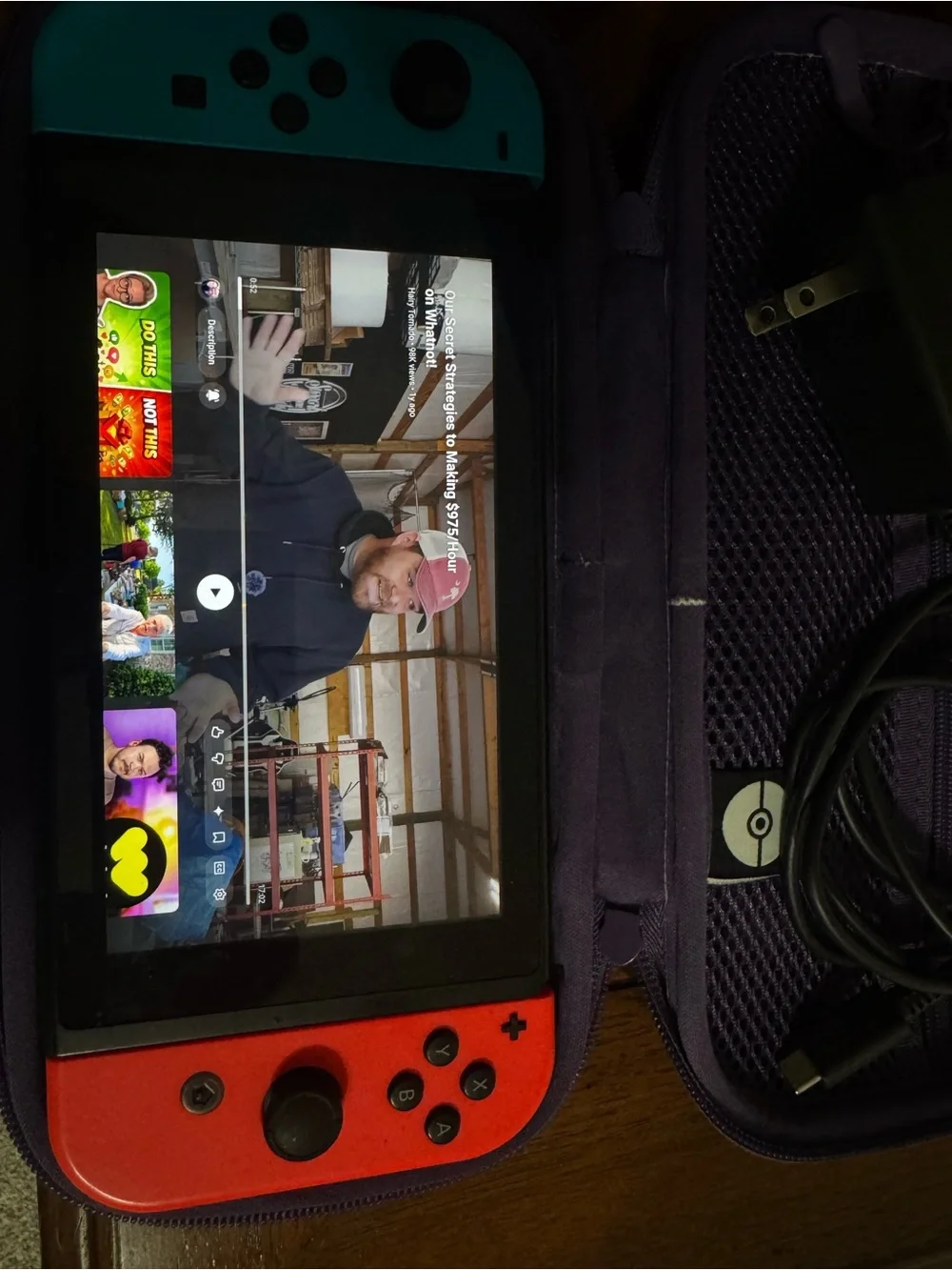 Nintendo Switch with Blue Left & Red Right Joy-Con and Purple Carry Case